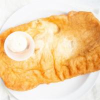 Giant Scone · also known as fry bread, this scone fills a large plate , served with honey butter on the side