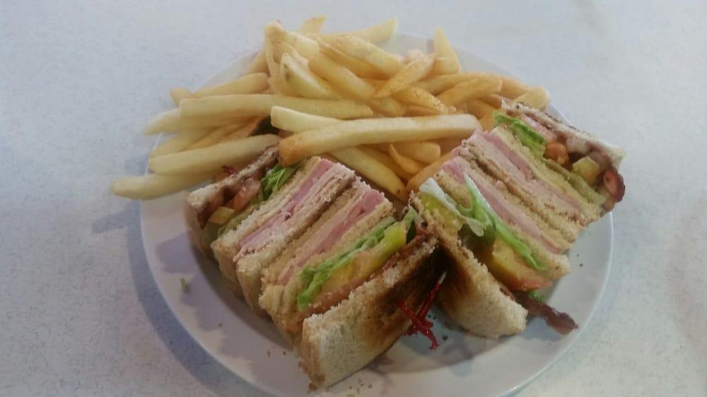 Dagwood Club · ham,turkey,cheese, bacon, lettuce,mayo and tomatoes combined in a triple decker  club sandwich.
served with frys