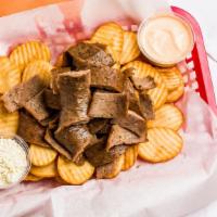 Gyro House Fries W/ Gyro Meat · Round cut fries w/ Gyro meat. Comes with a side of spicy garlic and fetta cheese.