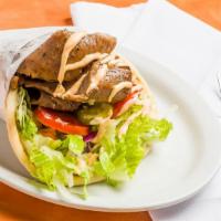 Lamb Gyro · Slow roasted lamb and beef slices, seasoned with our special mediterranean spices topped wit...
