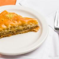 Baklava With Walnuts · Delicate layers of filo pastry filled with walnuts and pistachio, moistened with a light sug...