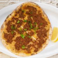 Lahmaju · Stone fire flat-bread with ground beef marinated in our signature sauce.