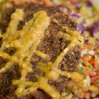 Southwest Vegan Bowl · Black bean patty on quinoa + rice topped with sautéed mushrooms, cabbage, pico de gallo and ...