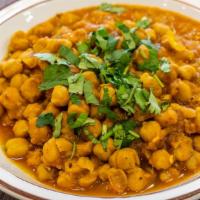 Chana Masala · Gluten-free. Garbanzo beans cooked with ginger, garlic and aromatic North Indian spices.