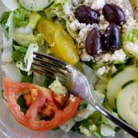 Greek Salad · Romaine, cucumber, tomato, red onion topped with Greek Kalamata olives and feta cheese and b...
