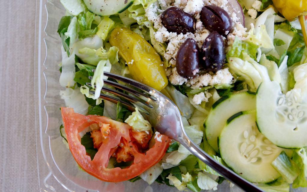 Greek Salad · Romaine, cucumber, tomato, red onion topped with Greek Kalamata olives and feta cheese and balsamic vinaigrette
