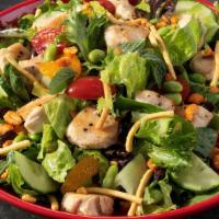 Singapore Chicken Salad · Sweet spring mix and romaine hearts, English cucumber, grape tomatoes, edamame, black beans,...