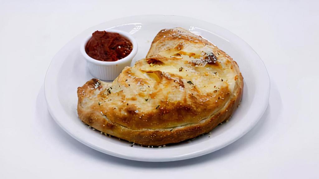 Calzone · A half-moon pizza pocket, stuffed with mozzarella and ricotta cheese and your choice of up to 3 toppings. Baked to a golden perfection, sprinkled with fairy dust and served with a side of marinara.
