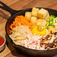 Fired Tofu Skillet Bibimbap · Lightly fried tofu, mountain veggies and sesame seeds in sizzling cast iron skillet, sweet a...