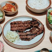 Grilled Zabuton Steak Bento · 6oz prime Zabuton Steak, come with gyoza sauce & spicy sauce. Served with rice, 4 side dishe...