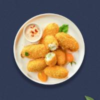 Just The Jalapeno Poppers · Fresh jalapenos filled with cream cheese, breaded, and fried until golden brown