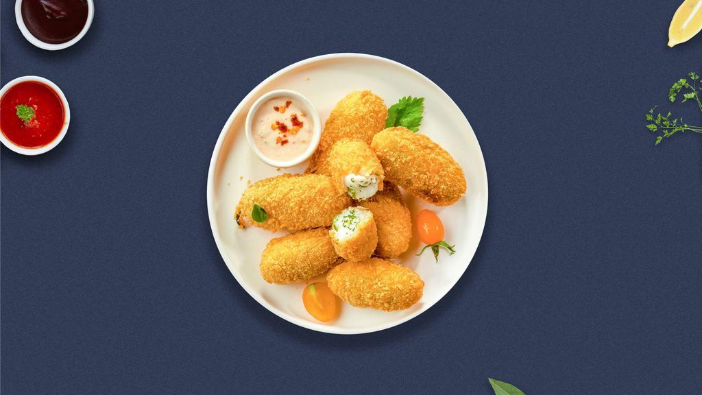 Just The Jalapeno Poppers · Fresh jalapenos filled with cream cheese, breaded, and fried until golden brown