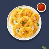 On The Onion Ring · Sliced onions dipped in a light batter and fried until crispy and golden brown.