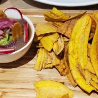 Cuban Nachos · Black beans hummus, guacamole, and pickled red onion served with plantain chips.