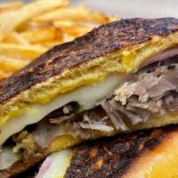 Havana Midnight Sandwich (Medianoche) · Smoked ham, roasted pork, Swiss cheese, pickled, homemade mustard sauce, sweet egg dough bre...