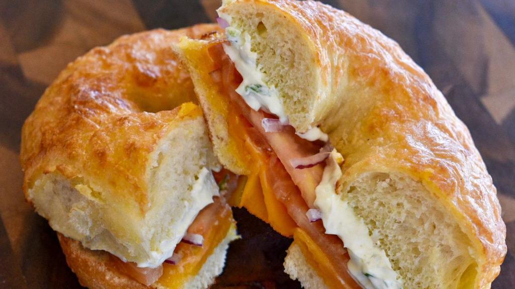 Bagel Melt · Melted cheddar cheese, red onion, tomato, and chive cream cheese on a choice of toasted bagel.