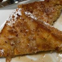 Full Almond French Toast · Six triangles of almond crusted French toast topped with real whipped butter and dusted with...