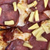 True Hawaiian Pizza · Canadian bacon, pineapple and mozzarella cheese with homemade roasted tomato sauce.