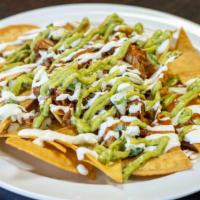 Nachos · Your choice of meat , beans , cheese , hot sauce , onions cilantro , guacamole , sour cream