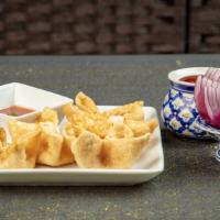 Crab Cheese Wontons (5) · Crispy wontons filled with a creamy mixture of imitation crabmeat and cream cheese. Served w...