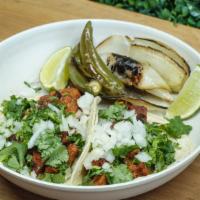 Vegan Carne Asada Plate · 3 house made Vegan Carne Asada tacos topped with onions and cilantro and your choice of drin...