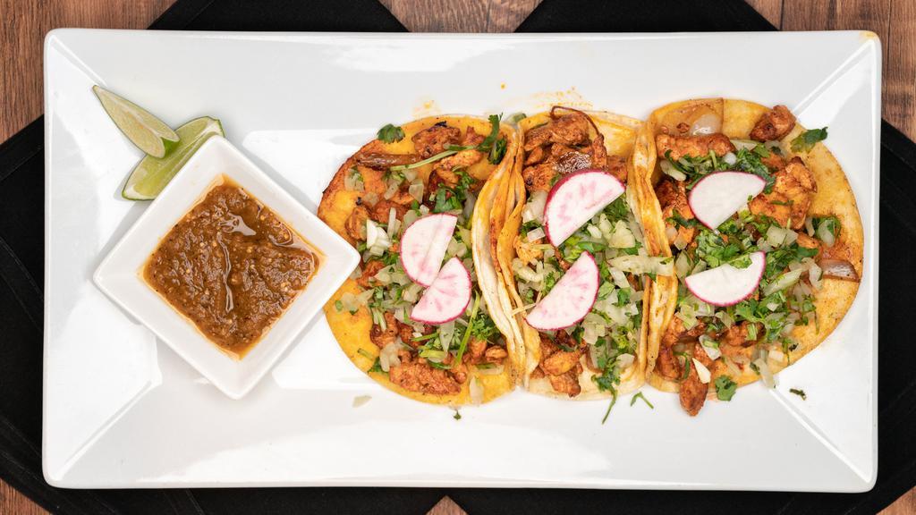 Street Tacos (3 Pcs) · Topped with onion, cilantro, and tomatillo salsa.