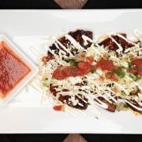 Enchiladas Michoacanas (3 Pcs) · Charred in chili ancho sauce, topped with cabbage, pico de gallo, sour cream, queso fresco, ...