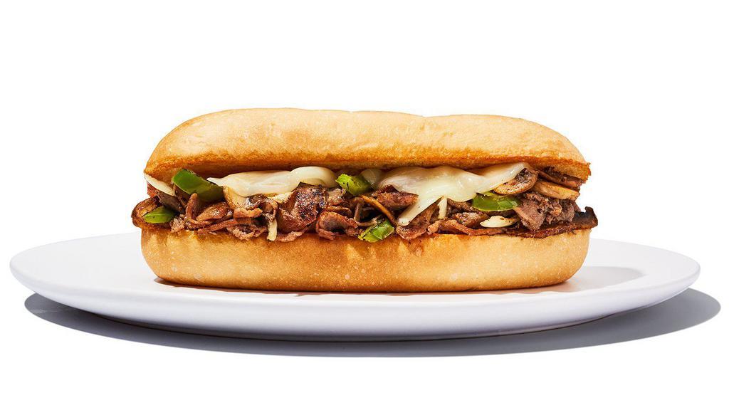 Philly Cheesesteak Sandwich · Yo, Adrian … I made you a sandwich! Steak or chicken topped with sautéed onions, green peppers, mushrooms and provolone cheese and served on a hoagie roll.