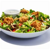 Garden Salad · Spring mix greens piled with diced tomatoes, crisp cucumbers, cheddar cheese, monterey jkack...