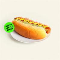 Vegan Hot Dog · Vegan hot dog with mustard and ketchup on a toasted bun.