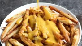 Vegan Cheese Fries · Fresh cut french fries with melted vegan cheese sauce.