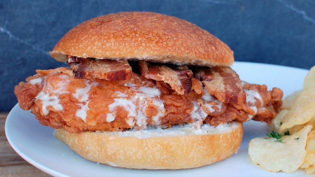 Chicken Bacon Ranch · Hand-breaded fried chicken breast, thick sliced slow-roasted bacon, and homemade ranch, all on a fresh baked roll. 
Comes with a side of our hand cut sea salt fries.