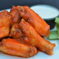 8 Bone-In Wings · 8 bone-in chicken wings that have been brined, fried, and tossed in one of our homemade sauc...