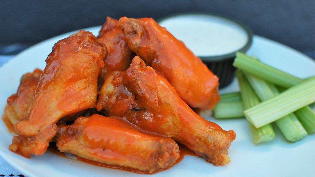 8 Bone-In Wings · 8 bone-in chicken wings that have been brined, fried, and tossed in one of our homemade sauces. Served with celery and your choice of dipping ranch or blue cheese.