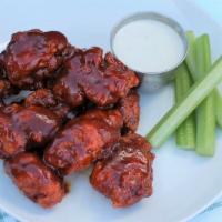 10 Boneless Nugs · 10 boneless wings, breaded and tossed in one of our house made sauces, served with celery, a...