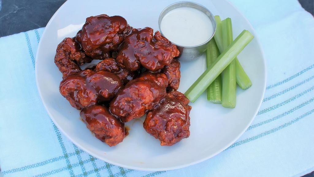 20 Boneless  Nugs · 20 boneless wings, breaded and tossed in one of our signature sauces. Served with celery, and your choice of dipping ranch or blue cheese.