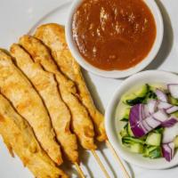 Chicken Satay · Chicken marinated in curry powder, barbecued. Served with peanut sauce and cucumber dip.