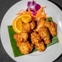 Chicken Wings · Garlic and pepper Thai style wings. Served with sweet and sour sauce.