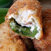 Jalapeño Poppers · Baked cream cheese-filled jalapenos and served with marinara dip.