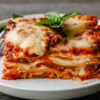 Lasagna Bolognese · With marinara sauce, mozzarella and beef.