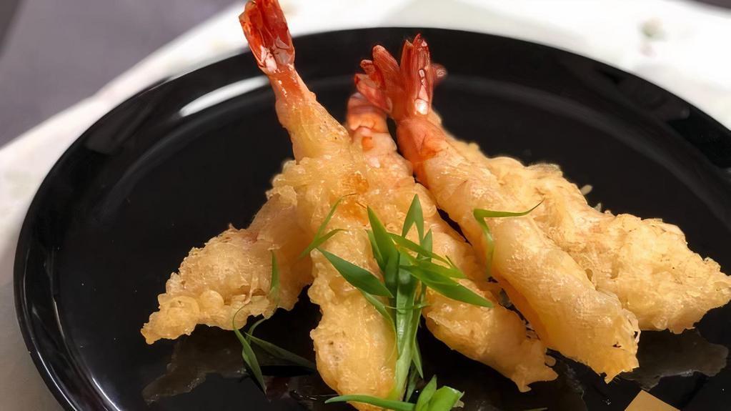 Shrimp Tempura Appetizer (7Pc) · 7 pieces of batter shrimp tempura served with sweet and sour sauce.