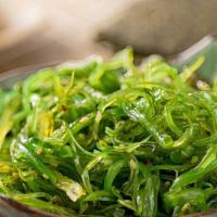 Seaweed Salad · Sliced seaweed, seasoned and topped with sesame seeds.