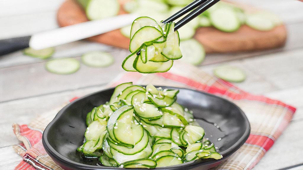 Cucumber Salad · Sliced cucumber, seasoned and topped with sesame seeds and shredded crab.
