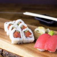 Spicy Fuku For You · One spicy tuna roll with two pieces of tuna nigiri.