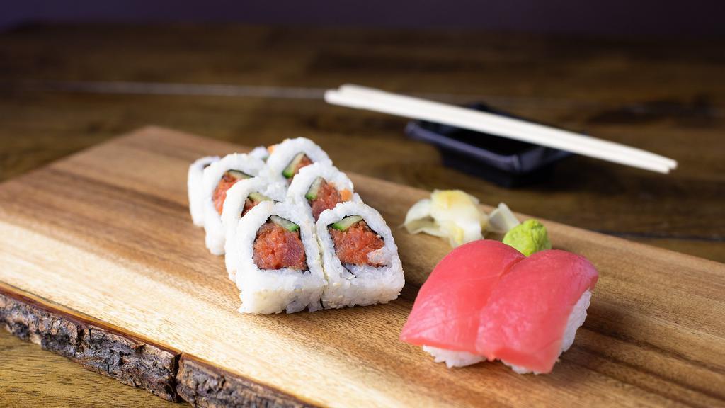 Spicy Fuku For You · One spicy tuna roll with two pieces of tuna nigiri.