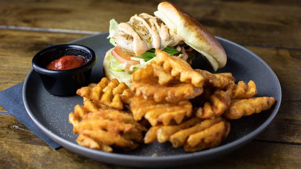 Teriyaki Chicken Sandwich · Grilled chicken breast, drizzled with teriyaki, served on a brioche bun with avocado, lettuce, tomato and chili aioli.. Served with Fuku fries.