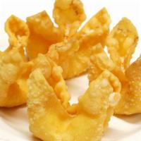 Crab Rangoon · Crispy wontons filled with a mix of imitation crab and cream cheese with a side of sweet chi...