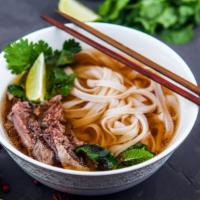 Well Done Beef Pho Noodle Soup · Hearty protein, rice noodles, cilantro, basil, and sliced onions served in a savory broth.