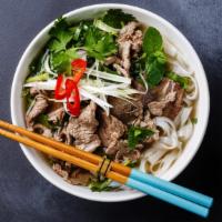 Combo Pho (Pho Dac Biet) · Rare steak, flank, tendon, beef meatballs, rice noodles, cilantro, basil, and sliced onions ...