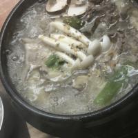 Ddukbaegi Bulgogi · Marinated beef soup with vegetables and glass noodles.